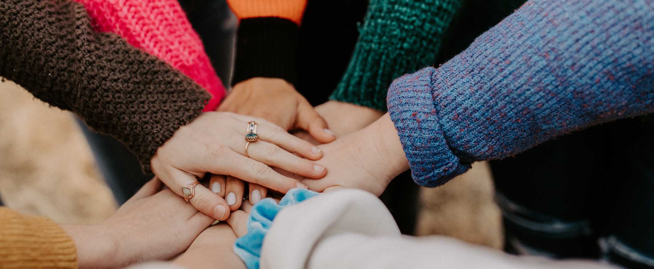 A group of women's hands
